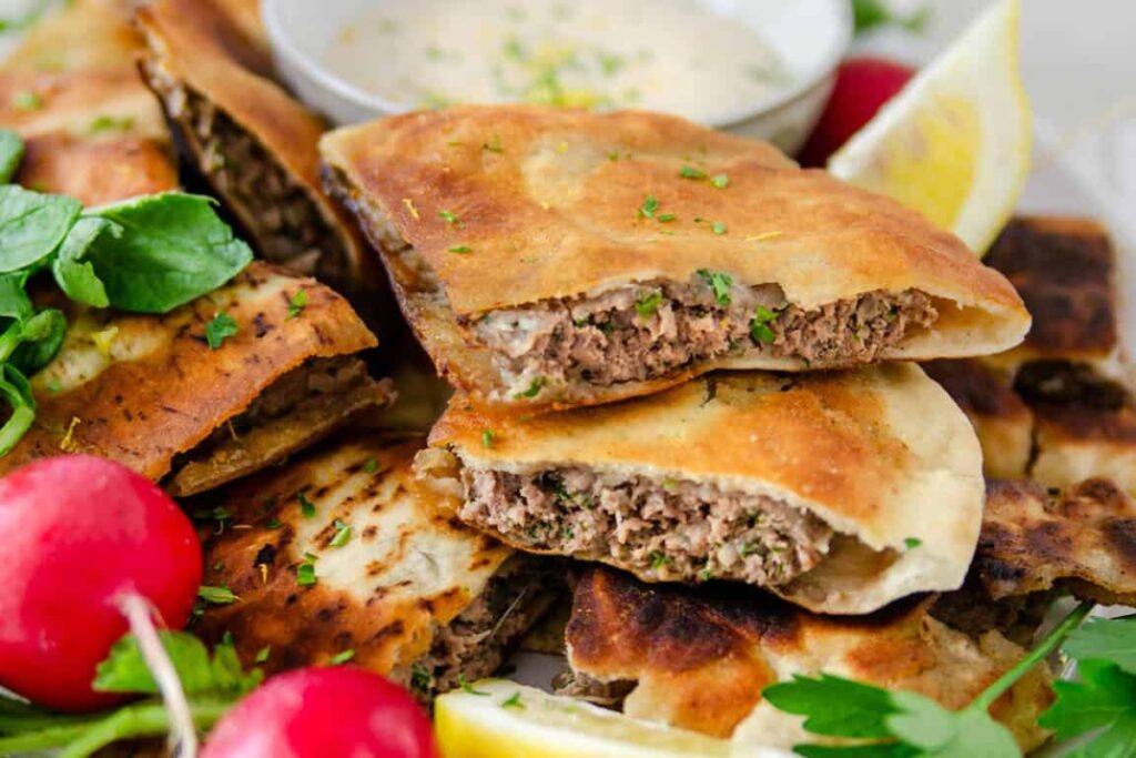 Two slices of Arayes (Meat Stuffed Pitas)