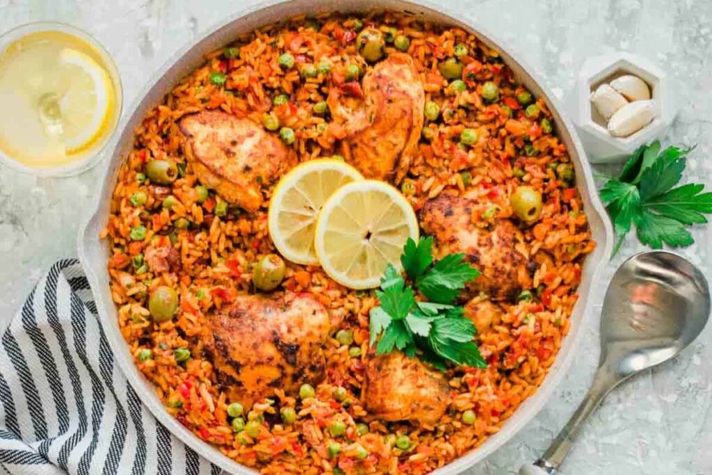 A pan of Arroz con Pollo (Latin One Pot Chicken and Yellow Rice)
