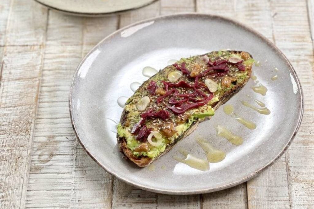 Avocado Toast With Olive Oil, Za'Atar And Pickles in a plate
