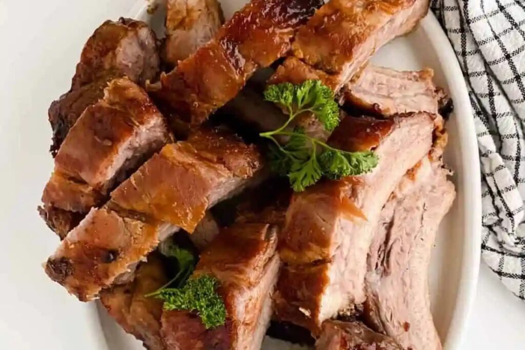 A plate of Easy & Tender Oven Baked Baby Back Ribs Recipe