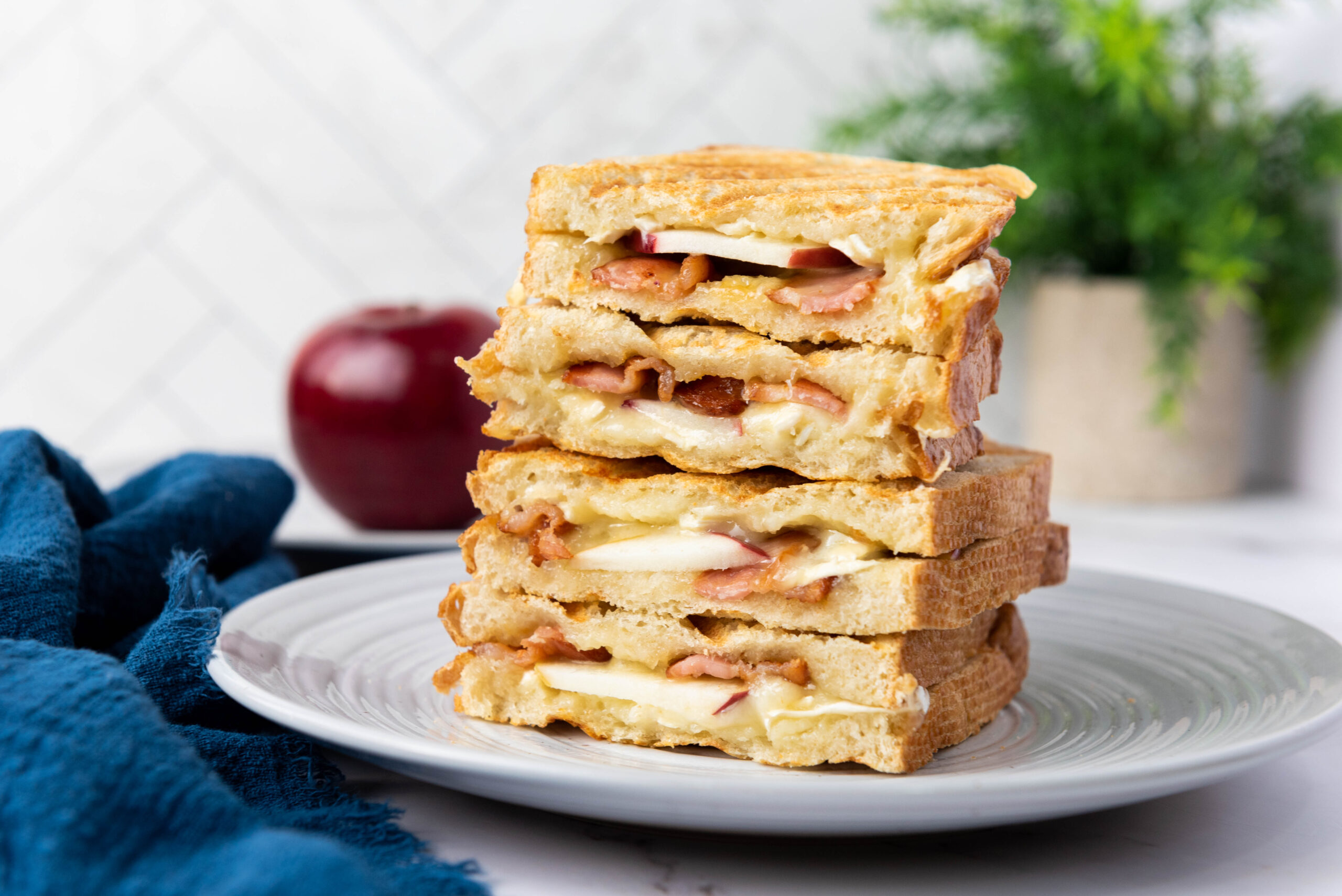 a stack of Brie and apple paninis