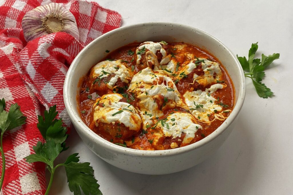 A bowl of saucy Meatball Casserole