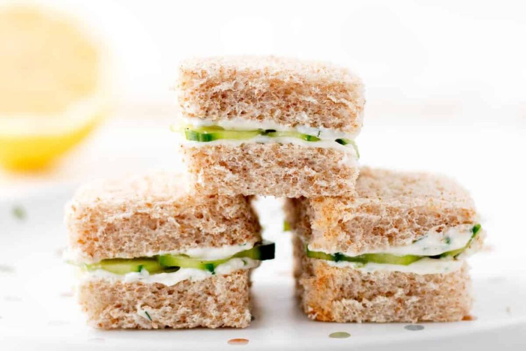 A plate of Mini cucumber sandwhiches