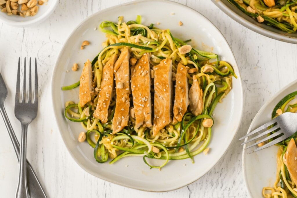 Peanut Sesame Chicken Over Zucchini Noodles