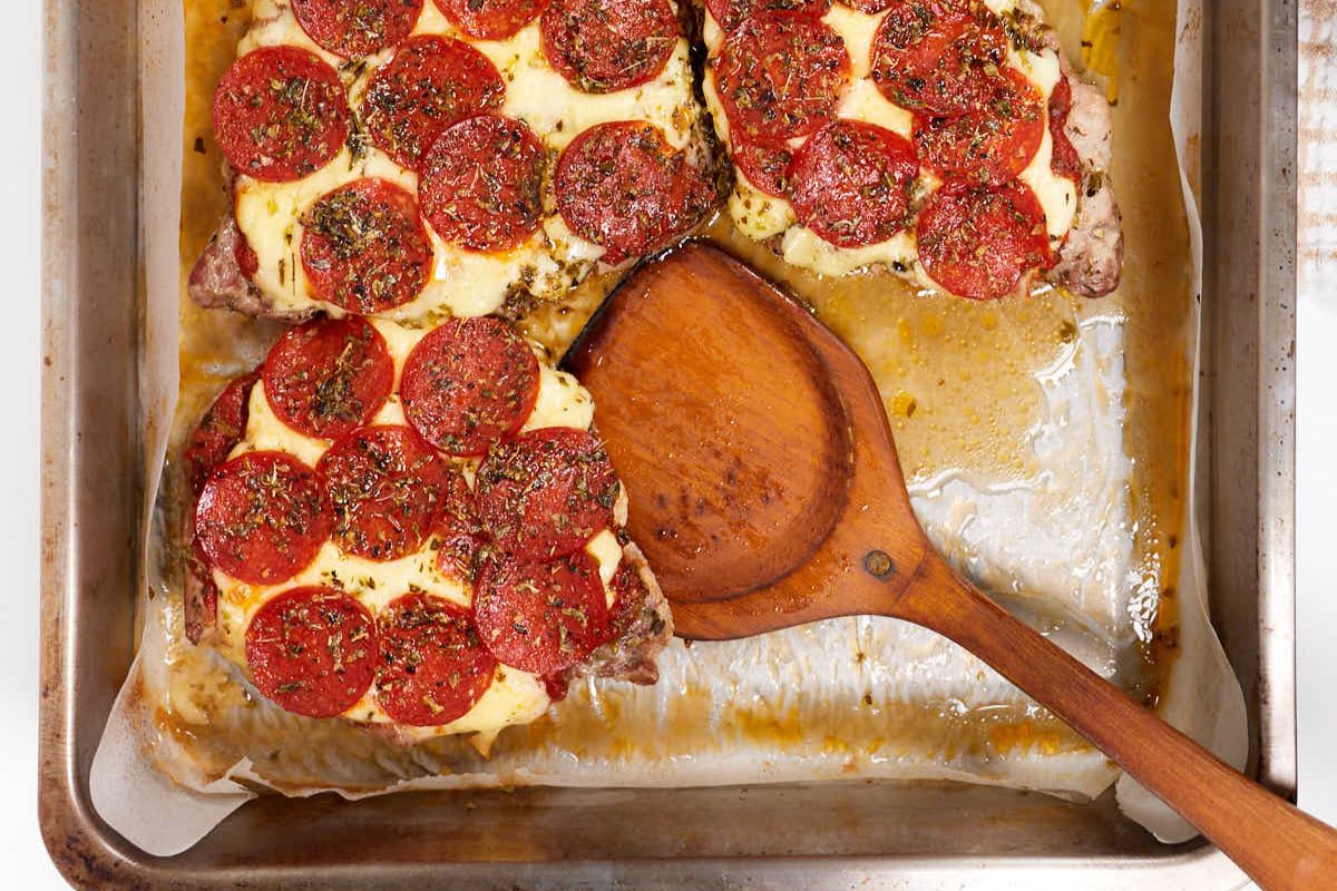 Pork Chop Pizzaiola with a serving spoon