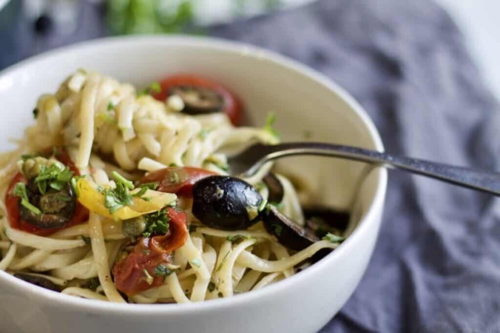 A bowl of Vegan One Pot Pasta Puttanesca
