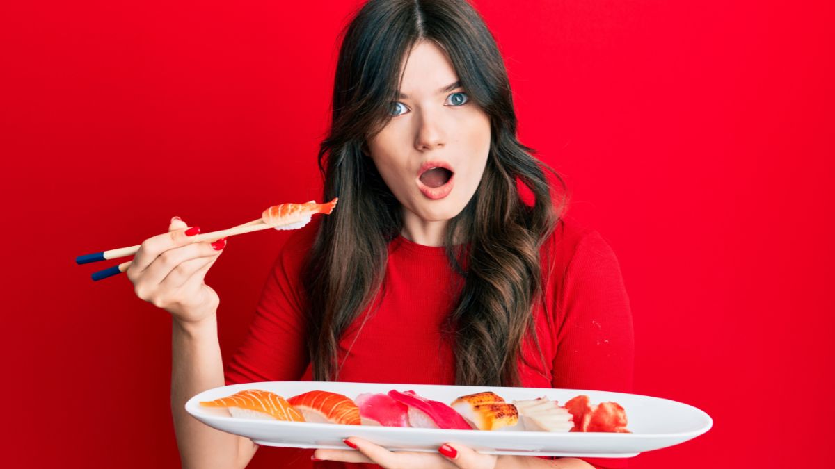 confused woman holding sushi