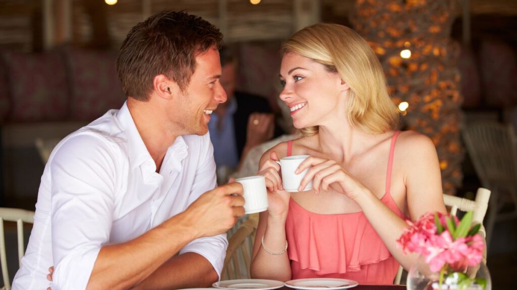 happy couple sitting with coffee