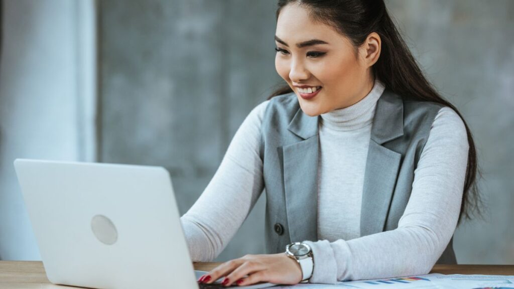 happy woman working on computer