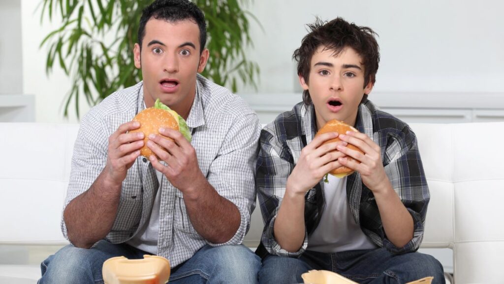 man and boy surprised with burgers