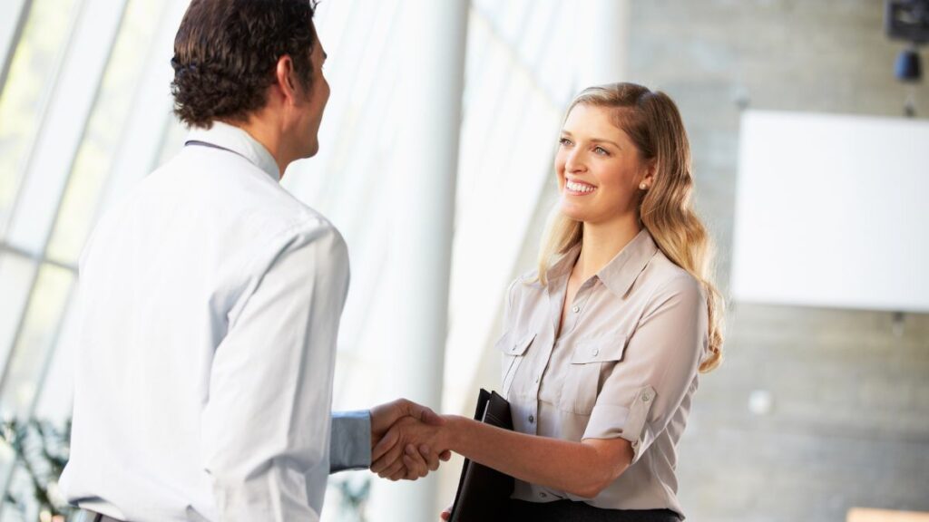 man and woman standing and talking