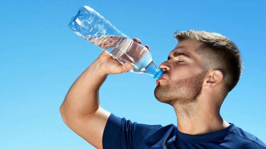 man drinking water