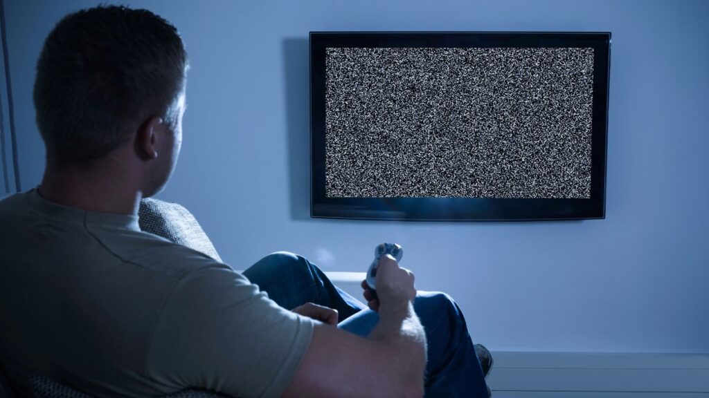 man watching blank tv