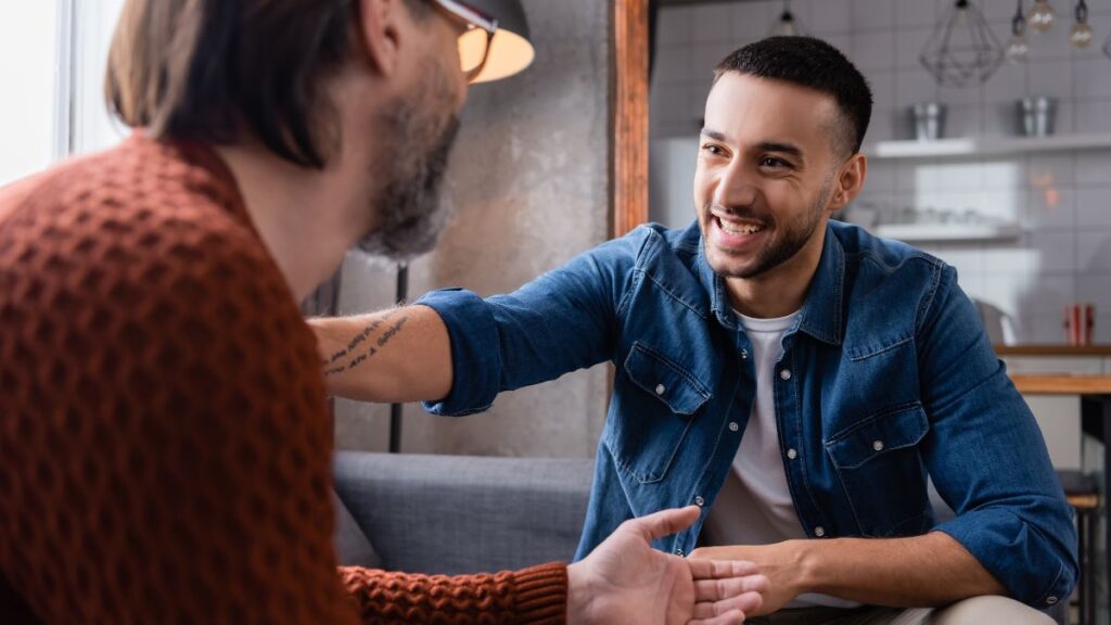 men talking happily