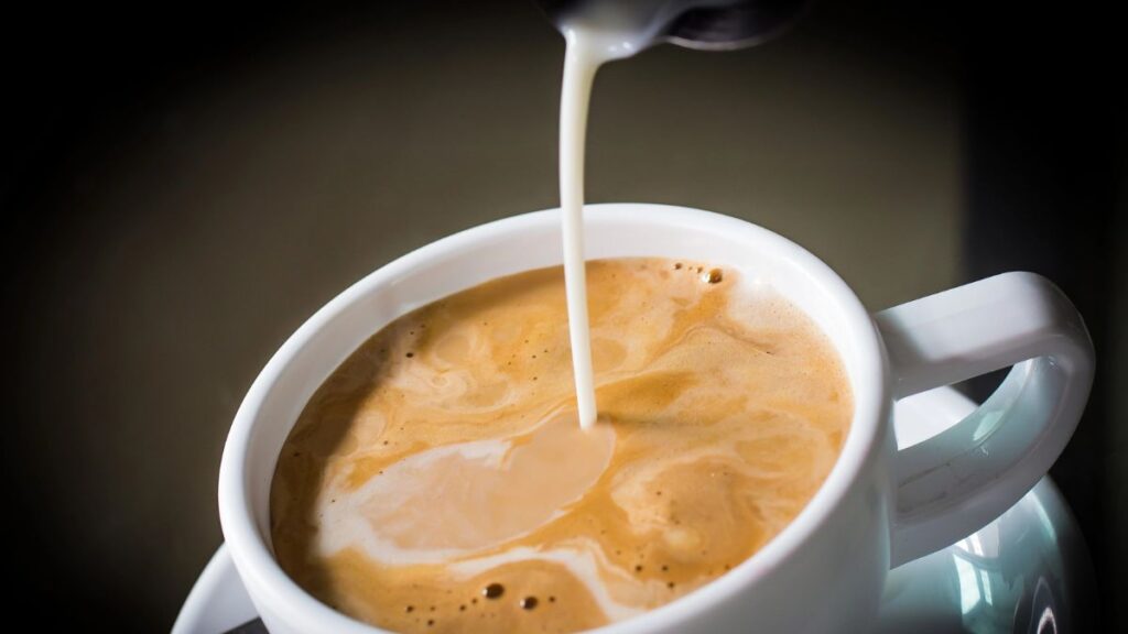 pouring coffee creamer