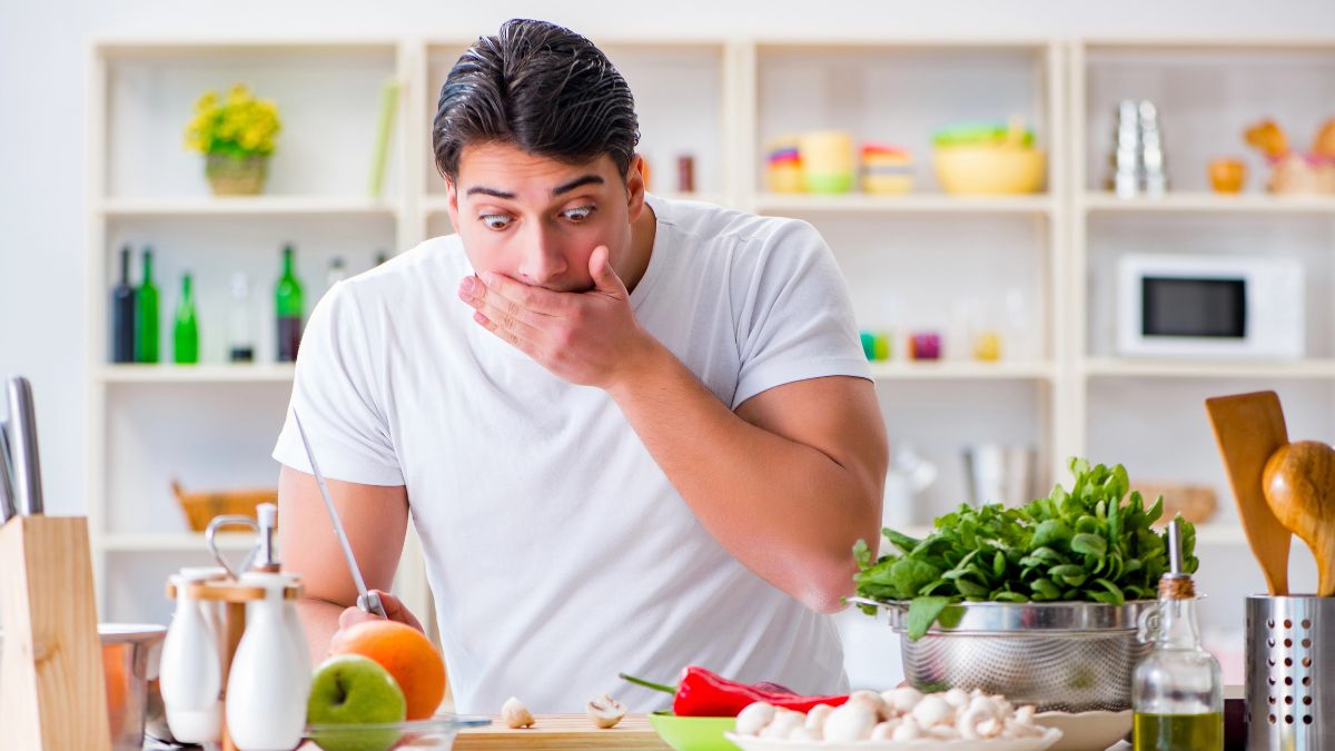 scared looking man in the kitchen