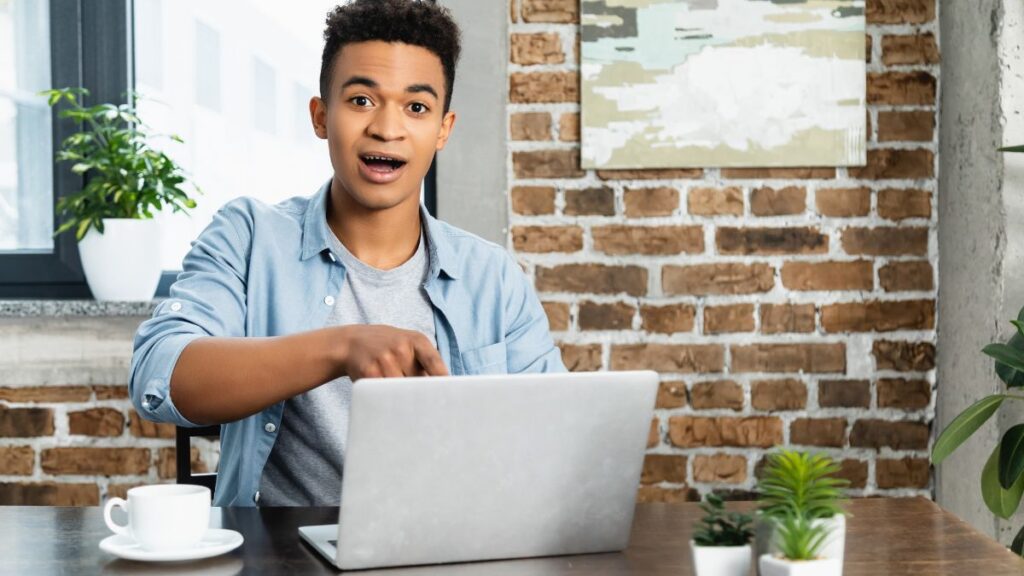 surprised man looking at computer