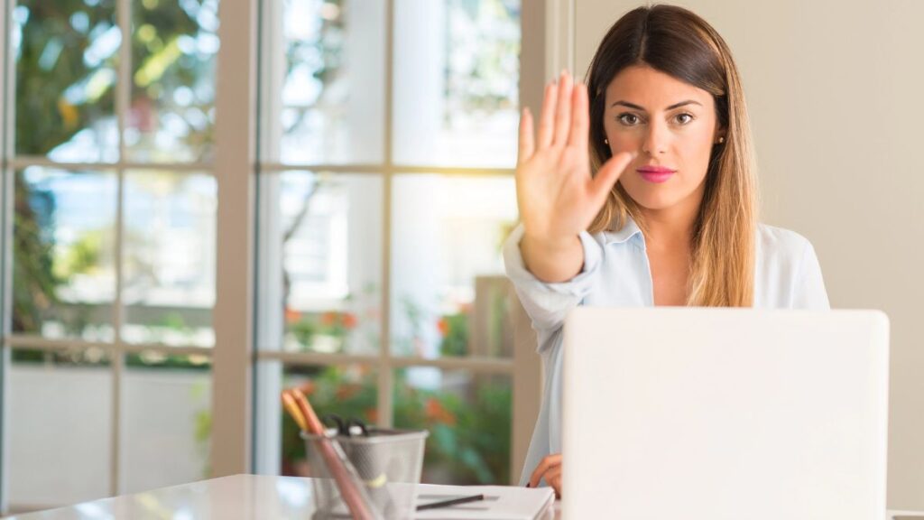 woman at computer showing stop