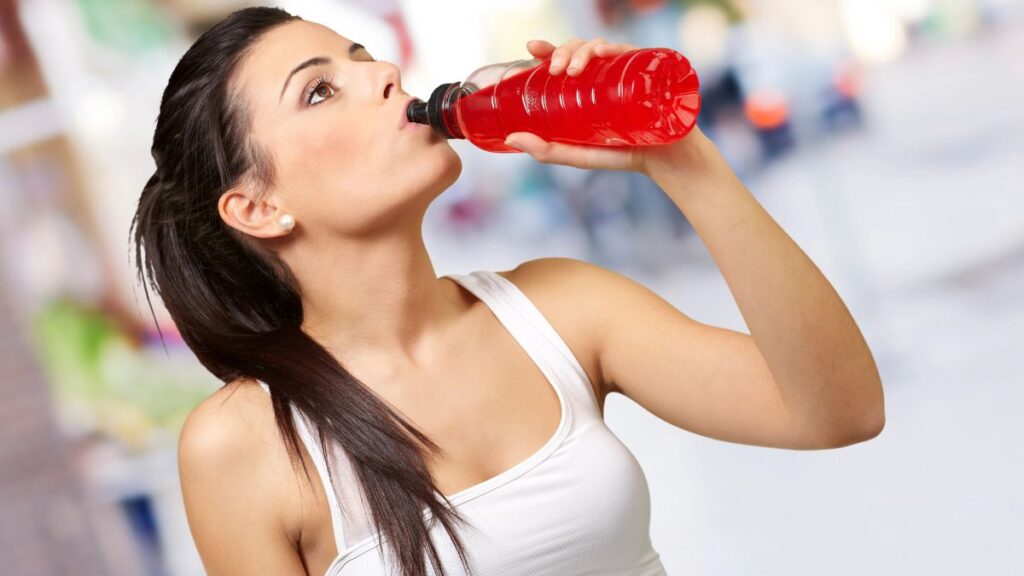 woman drinking from bottle