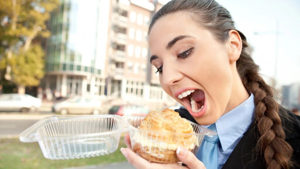 woman eating a donut