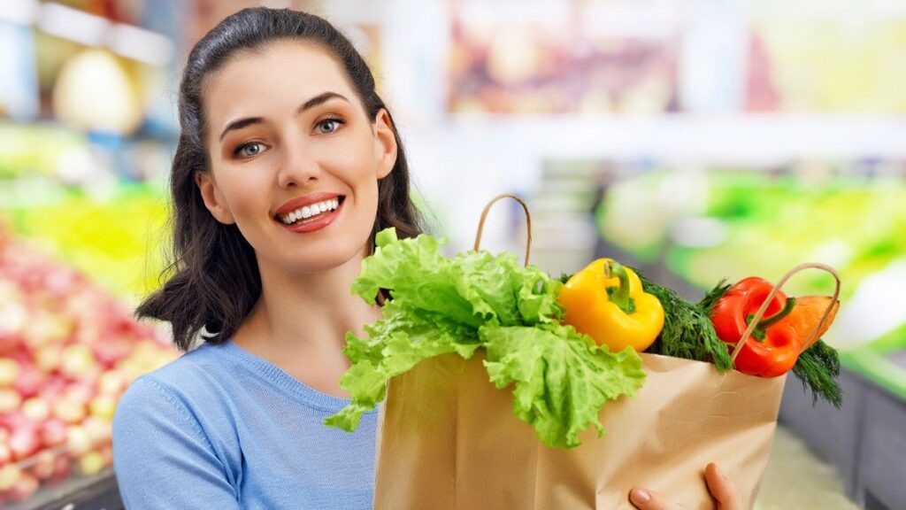 woman food shopping holding groceries