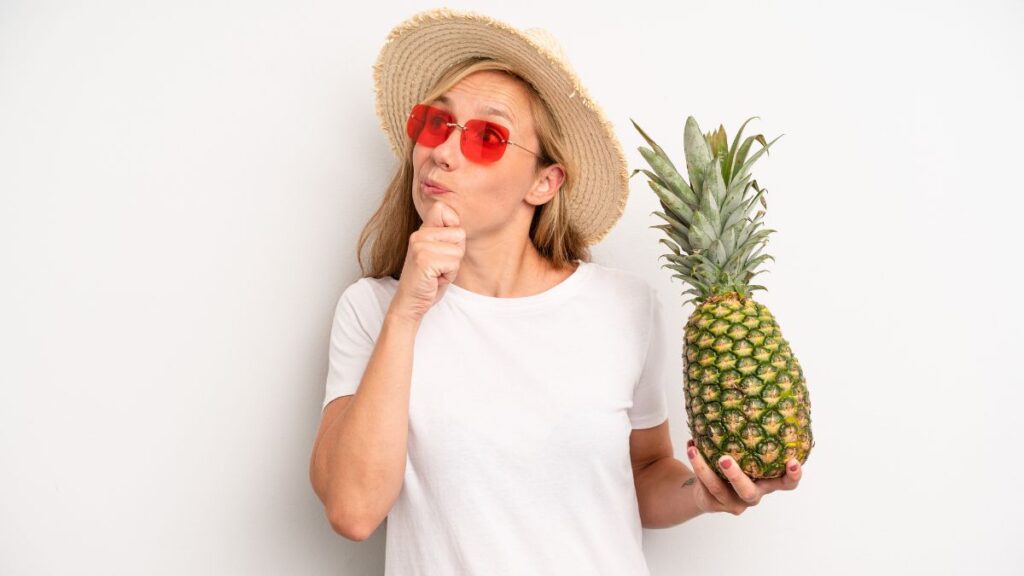 woman holding a Pineapple