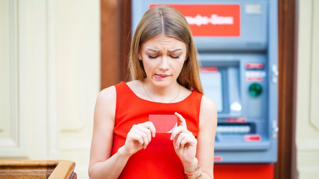 woman looking confused with credit card