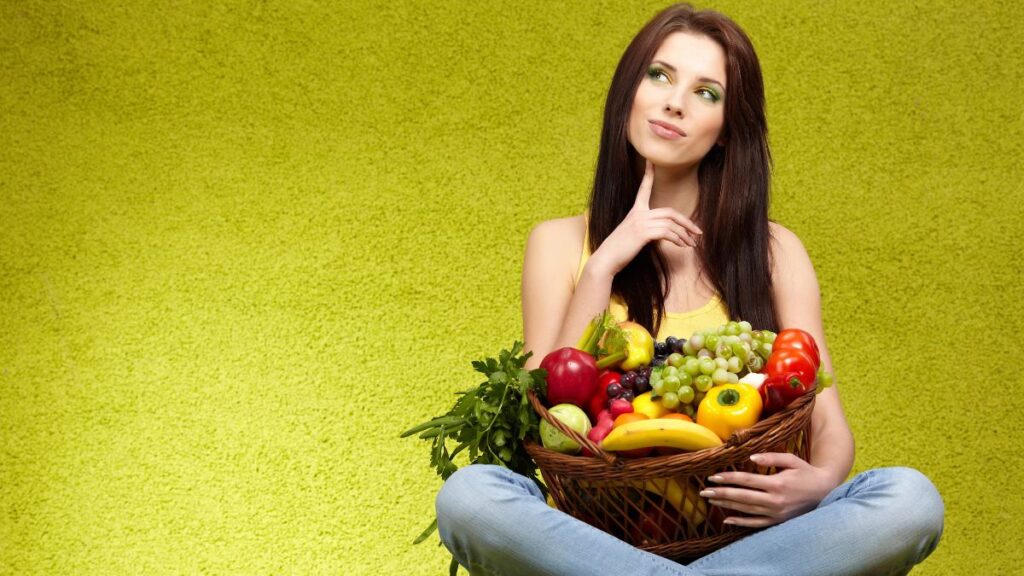 woman thinking with fruit basket