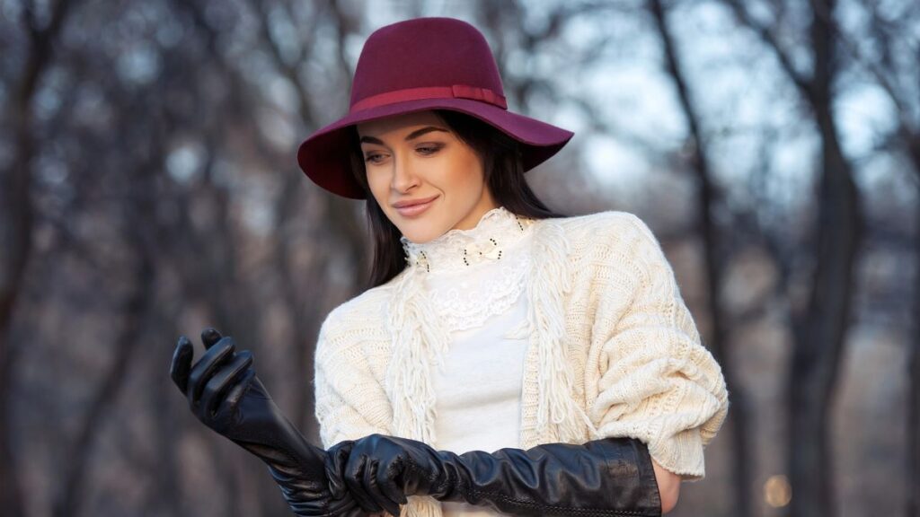 woman wearing a hat and gloves