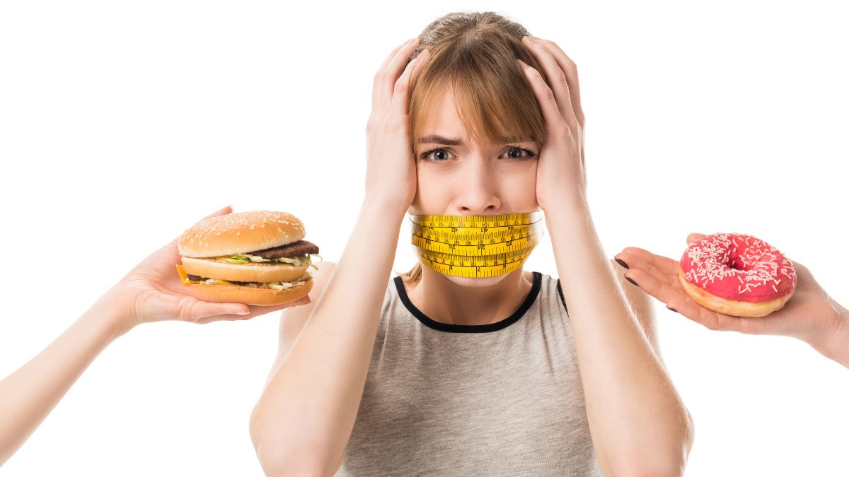 woman with mouth covered looking stressed about food