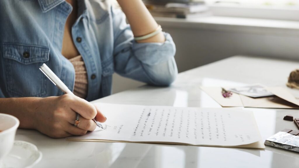 woman writing a note