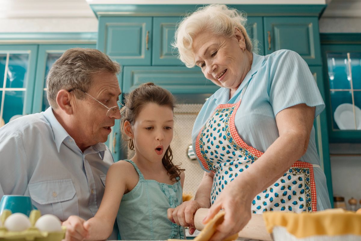 Grandma showing child how to bake.