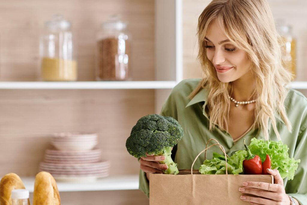 Woman taking vegetables from her paper bag