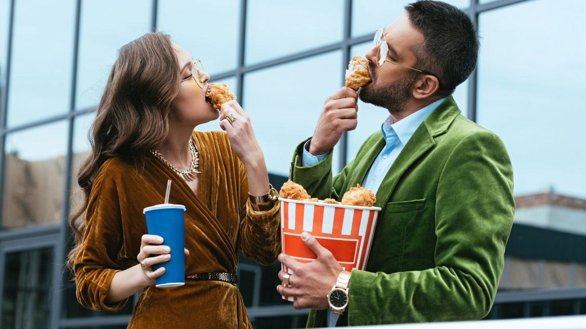 couple eating fried chicken