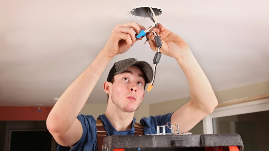 electrician working on lighting wires