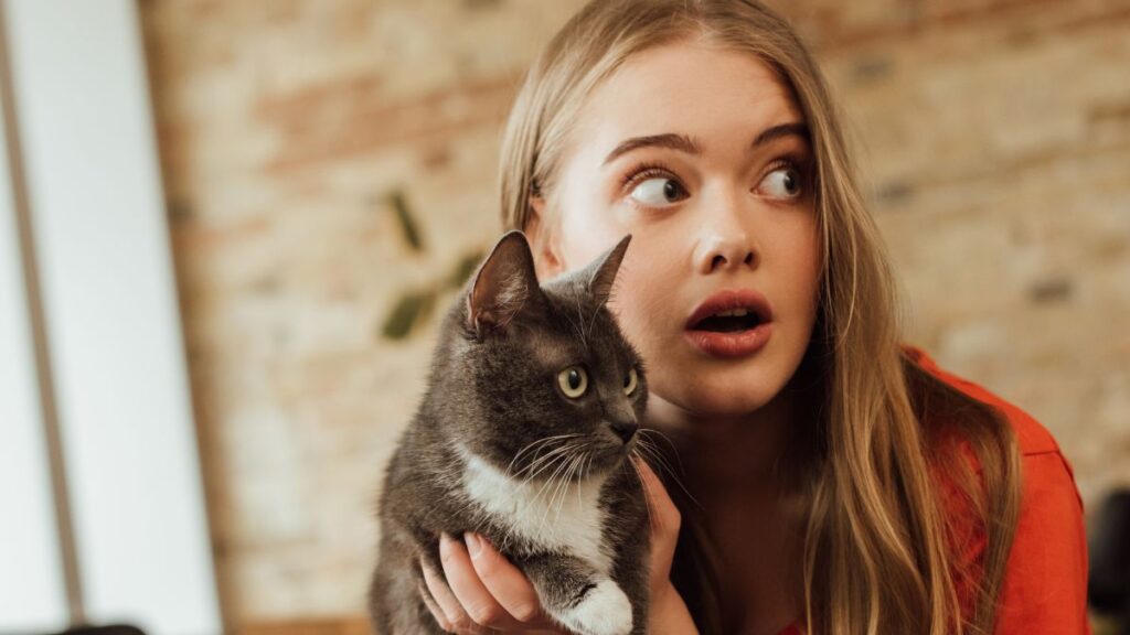 girl looking worried with cat