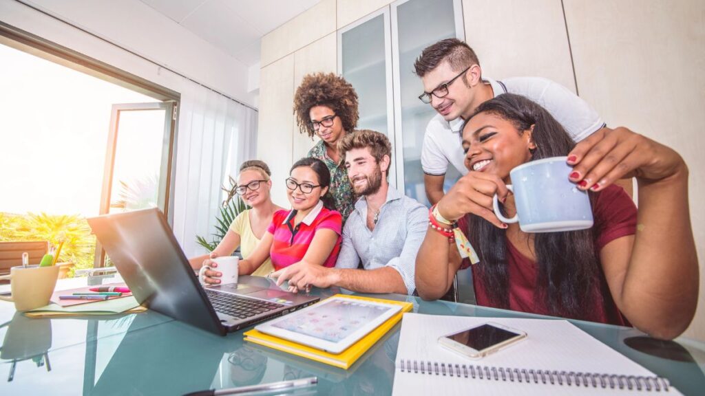 group of people working together at computer