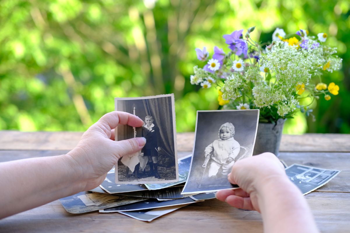 hands holding images from their childhood