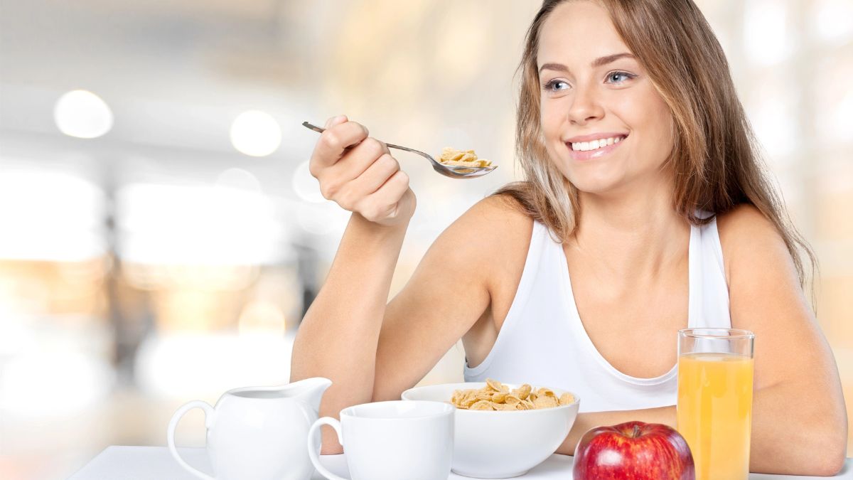 happy woman eating cereal