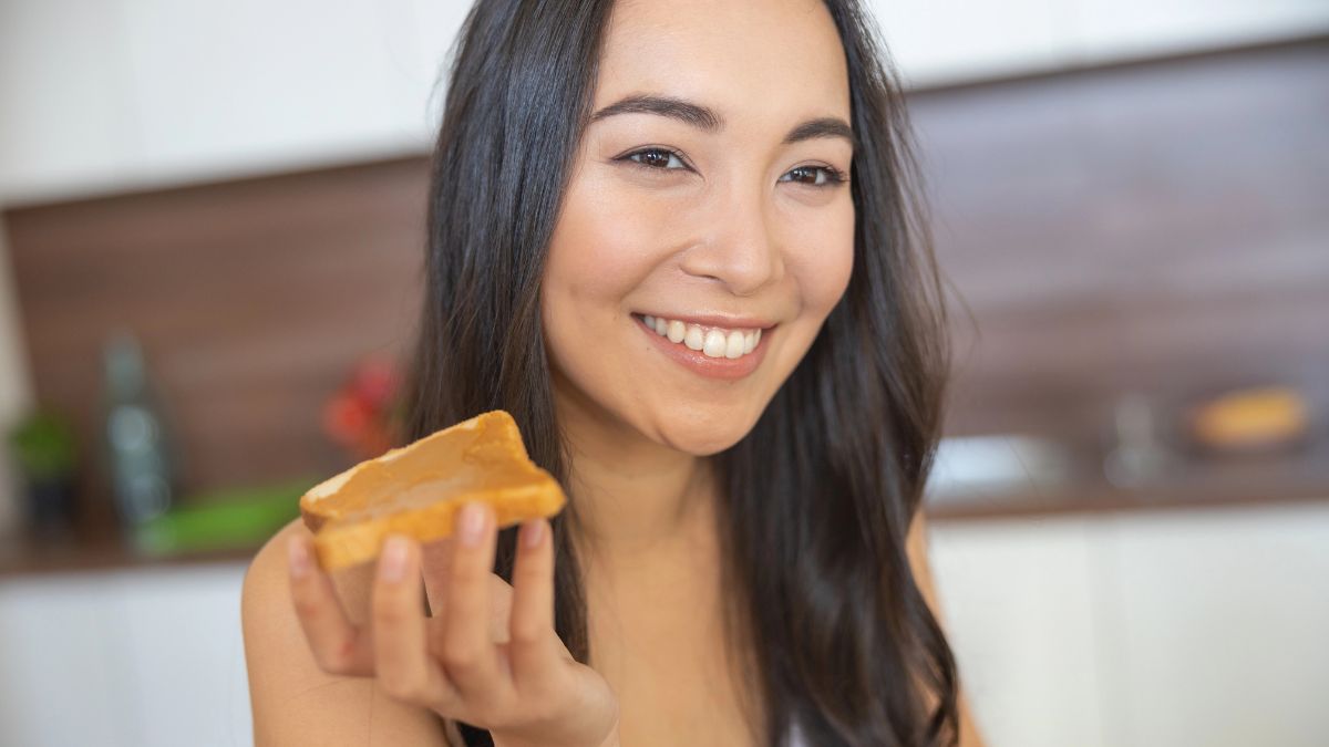 happy woman eating peanut butter