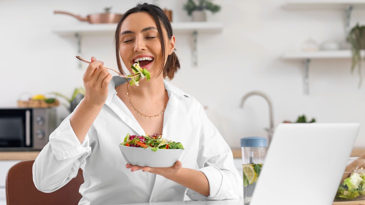 happy woman eating salad