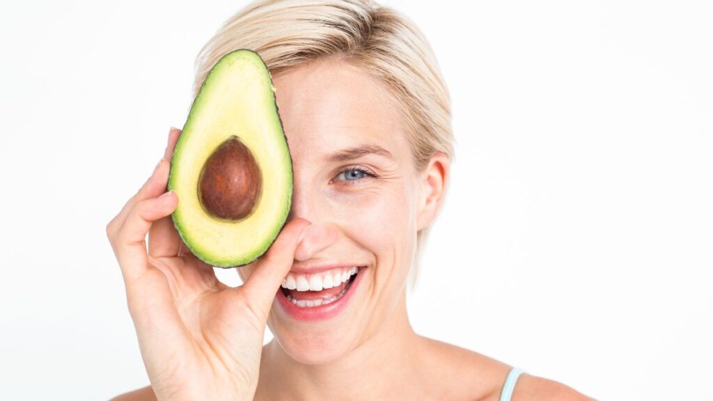 happy woman with avocado