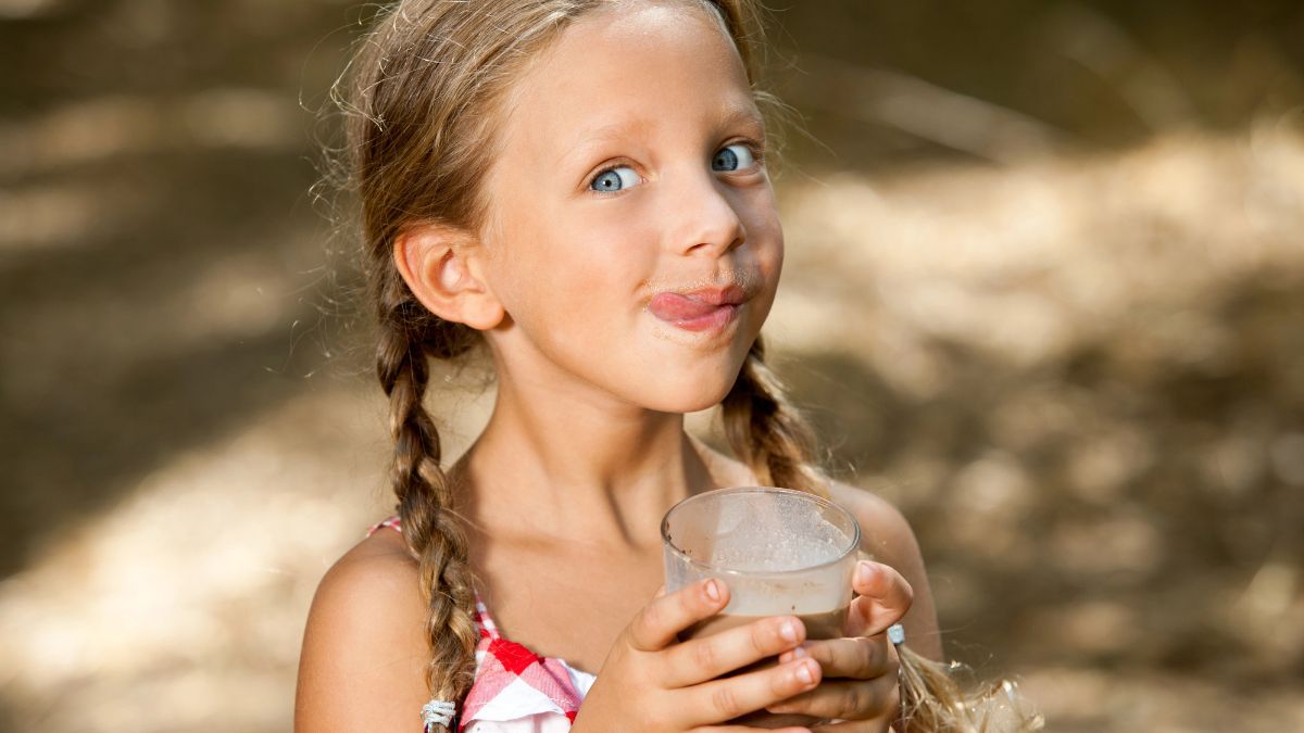 little girl drinking milkshake