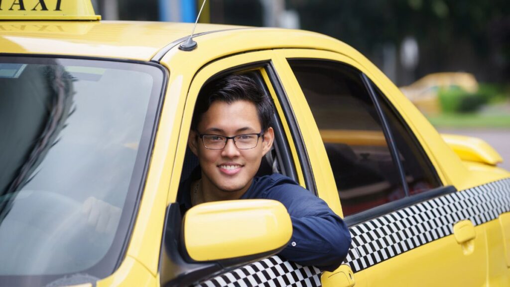 man driving taxi