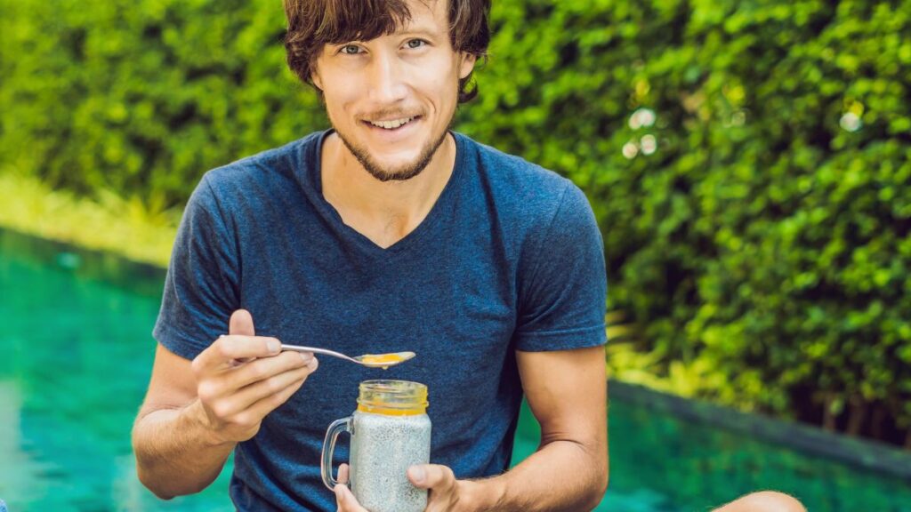 man eating chia pudding