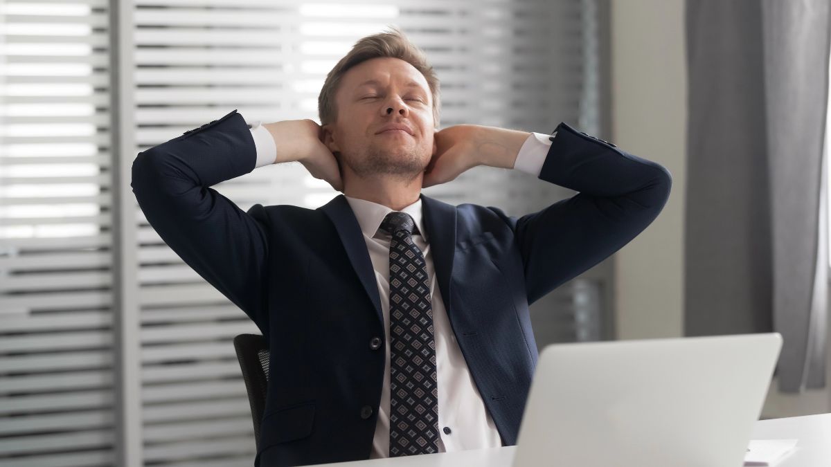 man looking relaxed at computer