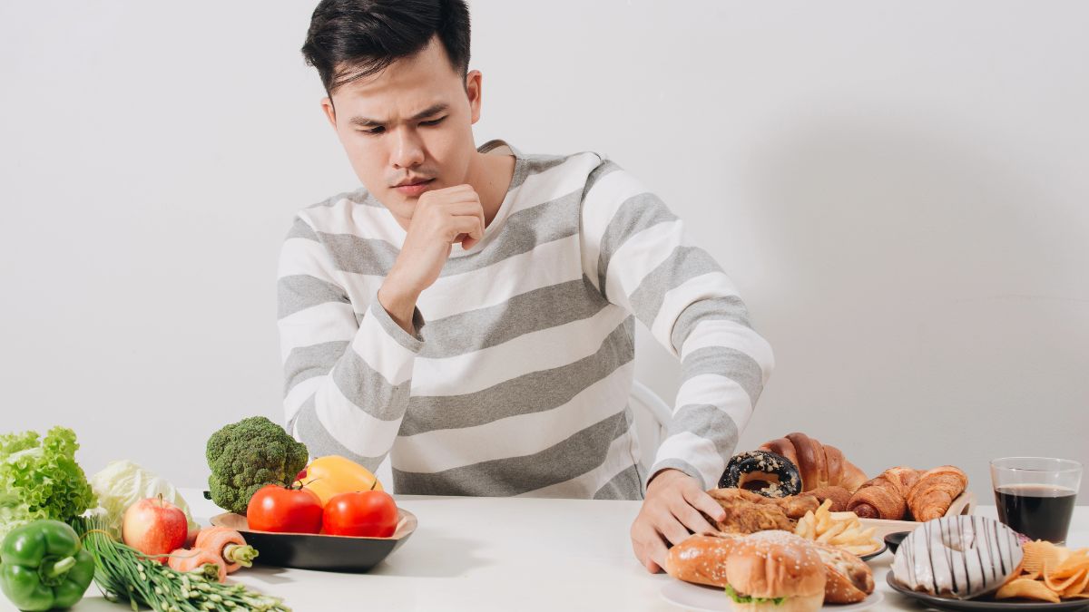 man pushing food away