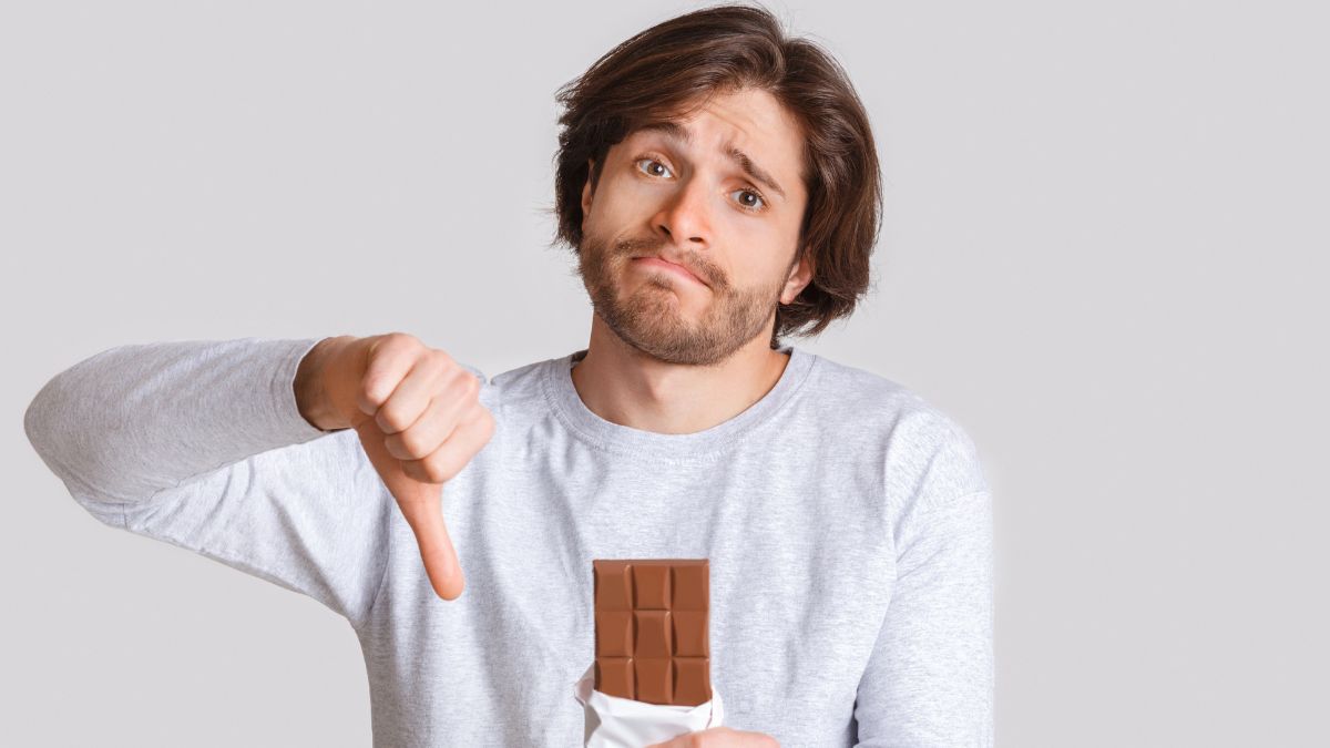 man showing thumbs down with chocolate