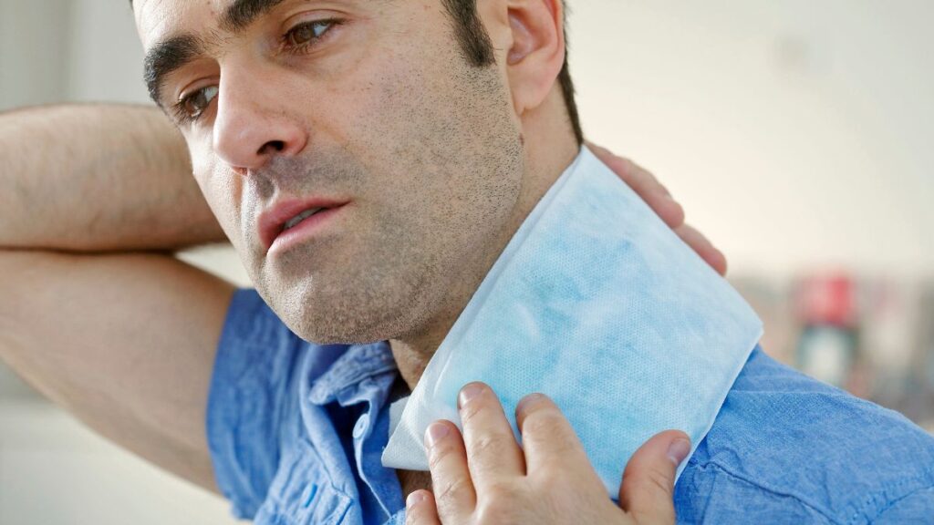 man with old heating pad