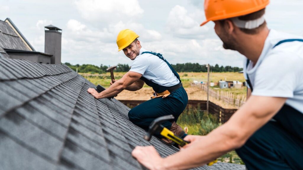 men repairing roof